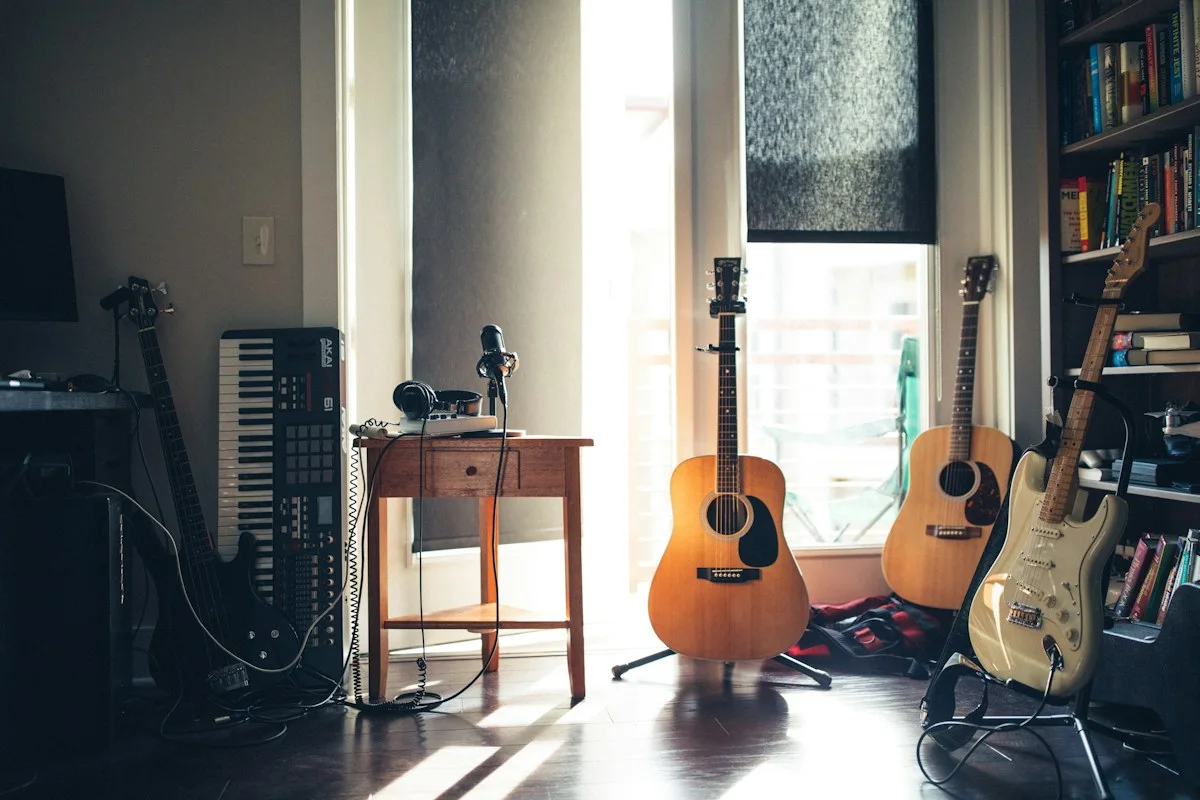 Realistic close-up photograph of headphones beside an unbranded vinyl record and record player in a British sitting room